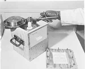 Hand Placing Isotope in Box