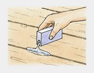 Human Hand Prints: Hand pouring talcum powder into cracks between old floorboards to prevent squeaks