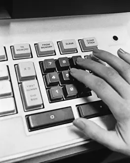 Calculator Prints: Hand using adding machine