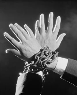 Hands chained together