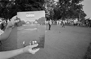 Foreground Prints: Hands Holding U.S. Open Magazine