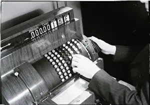 Economics Prints: Hands Pushing Buttons On A Cash Register