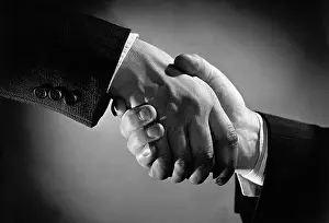 Handshake Between Men/Wearing Suits
