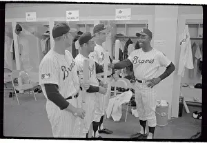 Hank Aaron Checking Players Bats for Readiness