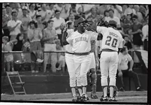 Hank Aaron Prints: Hank Aaron Being Congratulated on Run at Oldtimers Game