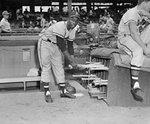 Hank Aaron Prints: Hank Aaron Getting a Baseball Bat