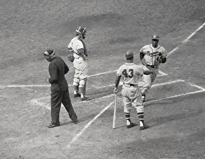 Congratulating Prints: Hank Aaron Being Greeted After Home Run
