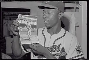 Hank Aaron Prints: Hank Aaron Holding 1930 Photograph of Bill Terry