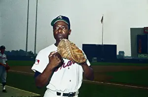 Hank Aaron Prints: Hank Aaron Holding Baseball Glove