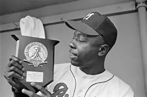 Hank Aaron Prints: Hank Aaron Holding Mel Ott Memorial Award