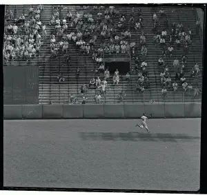 Hank Aaron Prints: Hank Aaron Running to Catch Baseball