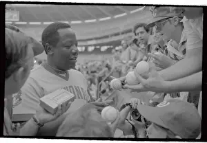 Hank Aaron Prints: Hank Aaron Signing Autographs