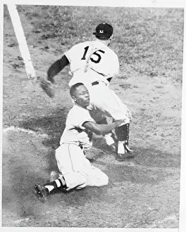 Hank Aaron Prints: Hank Aaron Sliding Across Home Plate