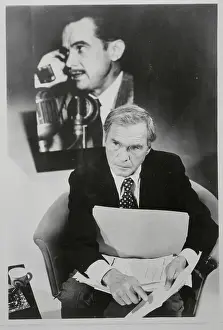 Hank Greenspun Sitting at Desk