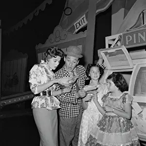 Prints of American actress Natalie Wood (1938 - 1981) with her sister Lana Wood and American burlesque comic and television presenter Pinky Lee (1907 - 1993) at a local circus, US, 6th January 1956 Grace, Glamour & Timeless Elegance: Happy Town Circus