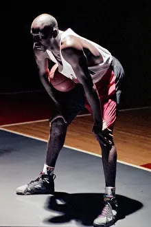 Prints of Award-winning basketball player Chicago Bulls #23 Michael Jordan stands by to be filmed for the Nike 'Hare Jordan' television commercial for Super Bowl XXVI on a sound stage in September Timeless Moments: A Visual Journey Through History’s Defining Images: Hare Jordan