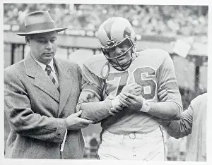 Harland Svare Holding His Wrist