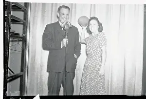 Prints of (Original Caption) Gridiron Glory: Harold Grange Giving Football Lesson to Woman Quarterback