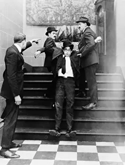 Cross Dresser Prints: Harold Lloyd Dragged Up Flight Of Stairs