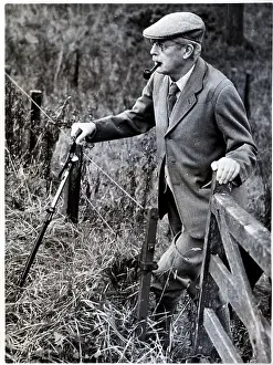 Harold MacMillan Enjoys a Pipe
