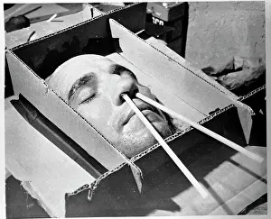 Harold Tasker Posing for a Plaster Mask