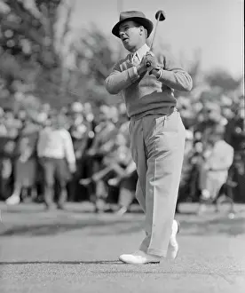 Harry Cooper Taking a Swing with Golf Club
