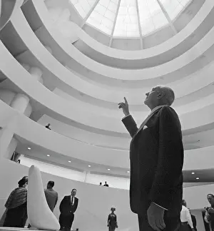 Guggenheim Prints: Harry F. Guggenheim Pointing to Interior of Museum Dome