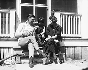 Harry Greb Playing Ukelele with Daughter