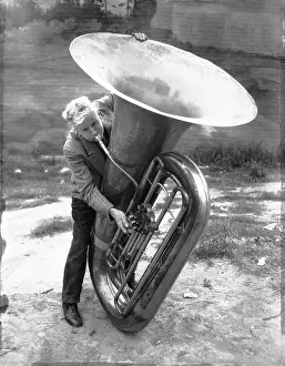 Pasadena Prints: Harry S. Hobson Attempting to Blow Large Bass Horn
