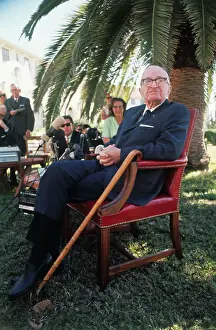 Harry S. Truman Sitting Outside with Press