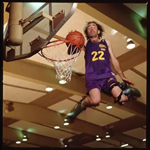 Prints of Actor Harry Shearer dunks a basketball mid-jump at Magic Johnson's basketball camp in Los Angeles in 1991. (Photo by Bonnie Schiffman/ Getty Images) Courtside Vibes: Stunning Basketball Prints: Harry Shearer Dunking Basketball