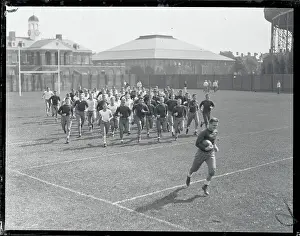 Endurance Prints: Harvard Teammates Jogging on Field
