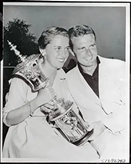 Harvie and Susan Ward Holding Golf Trophy