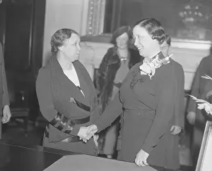 Hattie Caraway and Rose McConnell Long Shaking Hands