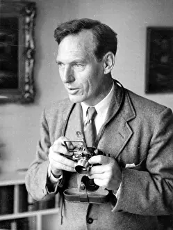 Prints of 24th December 1938: Joseph Haywood Magee, a Picture Post photographer, lines up a shot Discover the Vision of Haywood Magee – A Master of Mid-Century British Life: Haywood Magee