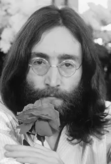 Head Shot of John Lennon With Rose