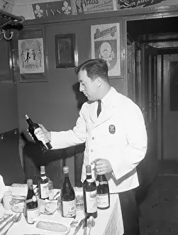 Waiter Prints: Head Waiter on Train with Wine Bottle