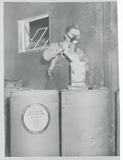 Health Department Worker Adding Fluorine to Water Tank