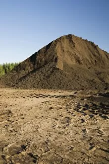 Images Dated 30th May 2012: Heavy tire tracks and a mound of topsoil in a commercial sandpit, Quebec, Canada