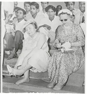 Prints of (Original Caption). Helen Keller at Gandhi Shrine Mahatma Gandhi Through the Lens: Helen Keller Removing Her Shoes