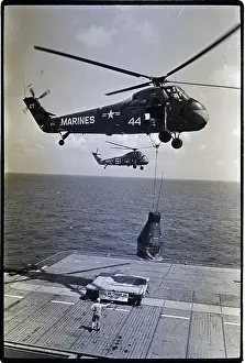 Lowering Prints: Helicopter Lowers Space Capsule to Ship