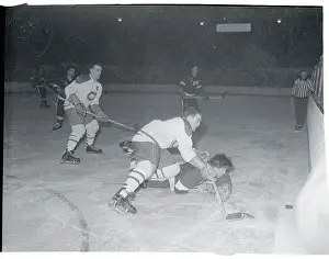 Henri Richard and Marty Pavelich Battling for the Puck