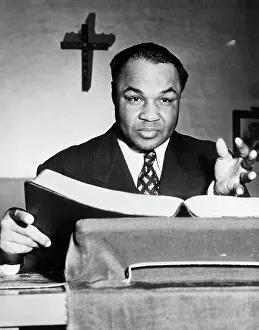 Preaching Prints: Henry Armstrong Gesturing Over Bible