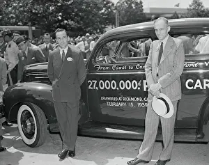 Henry and Edsel Ford Posing Next to a Car
