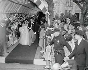 Henry Ford II and Wife Passing Through Crowds