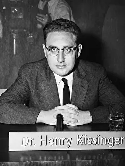 Latin Alphabet Prints: Henry Kissinger Seated at Desk