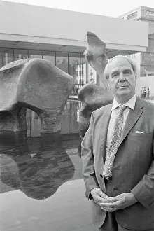 Henry Moore Standing Beside Sculpture