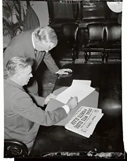 Prints of (Original Caption) A Monumental Collection Capturing the Life and Leadership of America’s 33rd President: Henry Wallace Signing Revised Neutrality Act