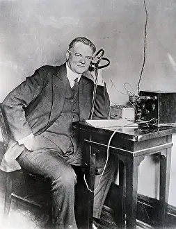Herbert Hoover Seated/Listening To Radio