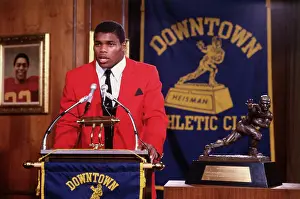 Hesiman Trophy Winner Herschel Walker with His Prize